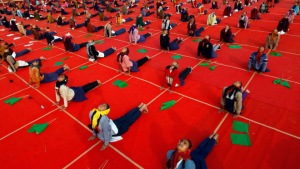 School girls attend a yoga session during a camp in the western Indian city of Ahmedabad January 11, 2014. REUTERS/Amit Dave (INDIA - Tags: EDUCATION HEALTH) - RTX179EV